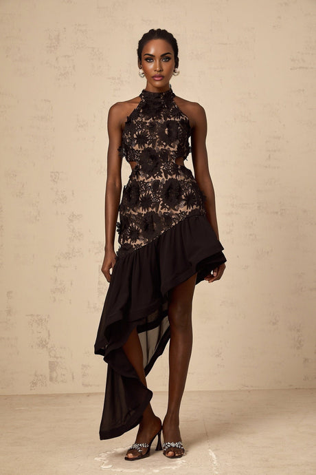 A black midi dress with an asymmetric hemline featuring floral applique details named Bernadette