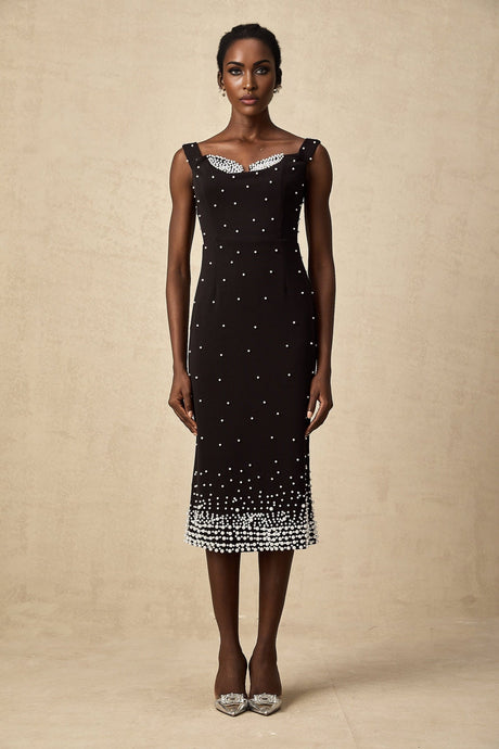 A black midi dress with faux pearl embellishments called Apolline