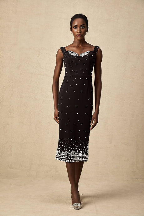 A black midi dress with faux pearl embellishments called Apolline