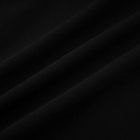 A black pleated midi dress with a button front closure named Viviane