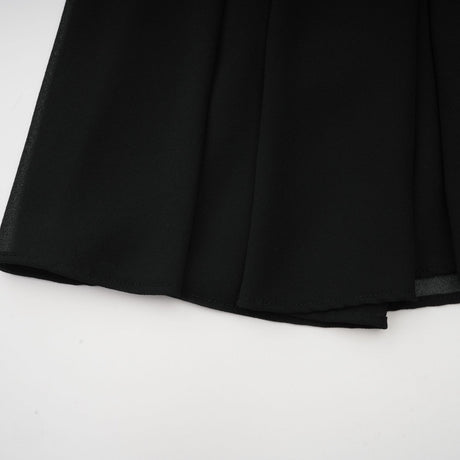 A black pleated midi dress with a buttonfront design named Viviane