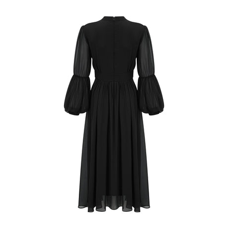 A black pleated midi dress with button front closure and sleeveless design featuring a fitted waist and flared skirt