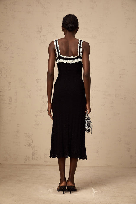 A black sleeveless midi dress with crochet knit detailing
