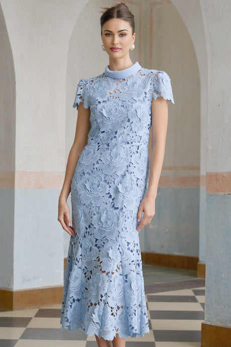 A blue lace midi dress with floral appliques decorating the bodice and skirt featuring a delicate feminine design with intricate lacework and a flattering mid length silhouette