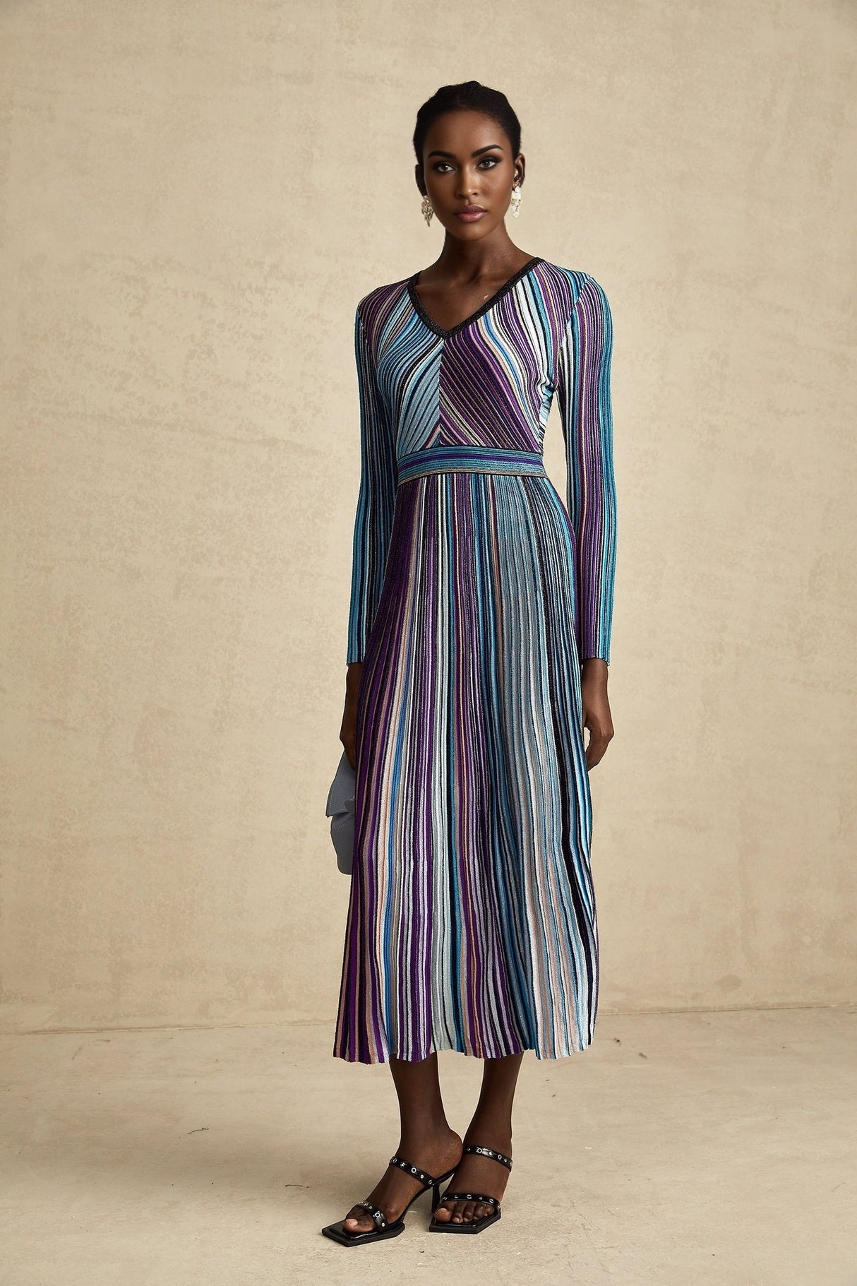 A blue metallic midi dress with pleated design and a flowing silhouette named Mathilde