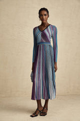 A blue metallic midi dress with pleated design and a flowing silhouette named Mathilde