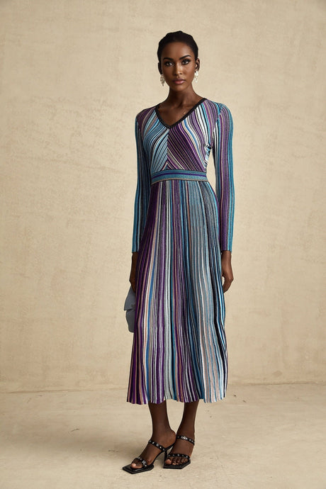 A blue metallic midi dress with pleated design and a flowing silhouette named Mathilde