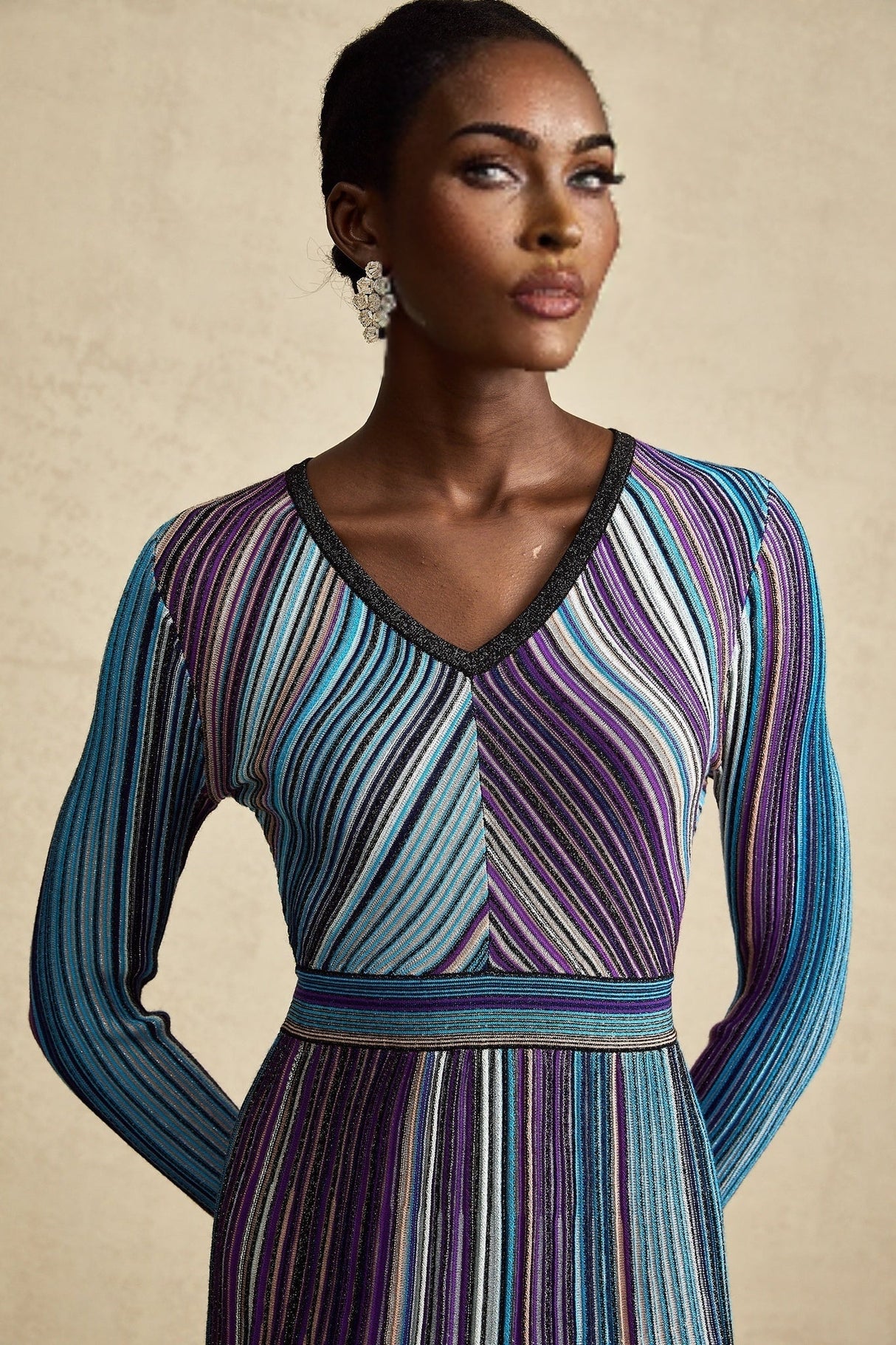 A blue metallic midi dress with pleated details and a shimmering finish named Mathilde