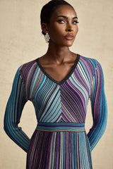 A blue metallic midi dress with pleated details and a shimmering finish named Mathilde
