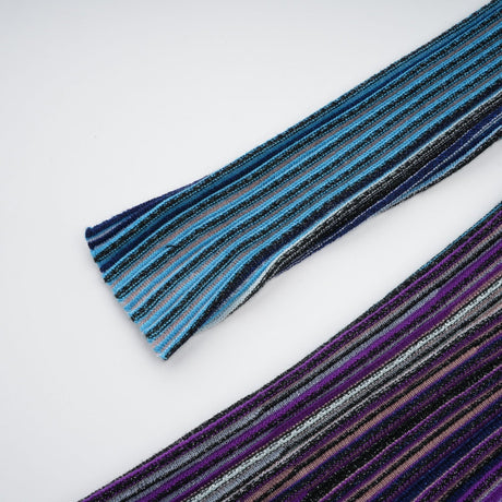 A blue metallic midi dress with pleats named Mathilde featuring a shimmering fabric and falling to mid calf length