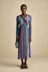 A blue metallic pleated midi dress with a flowing silhouette named Mathilde