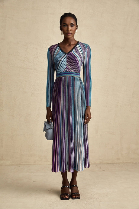 A blue metallic pleated midi dress with a flowing silhouette named Mathilde