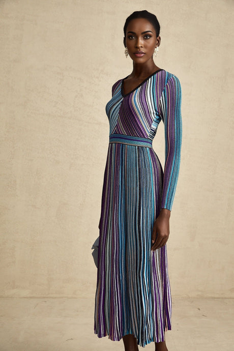 A blue metallic pleated midi dress with a flowing silhouette named Mathilde