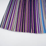 A blue metallic pleated midi dress with a flowing skirt and shimmering fabric named Mathilde