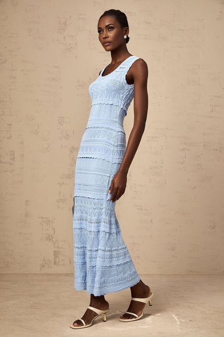 A blue midi dress with a crochet knit pattern featuring ruffled trim details