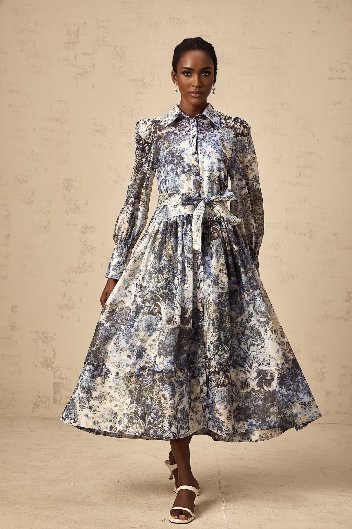 A blue midi dress with a floral print pattern called Irina