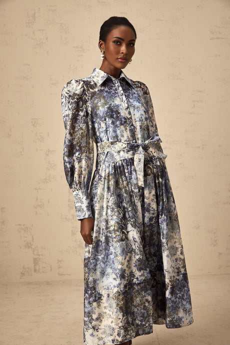 A blue midi dress with a floral print pattern named Irina displayed on a plain background