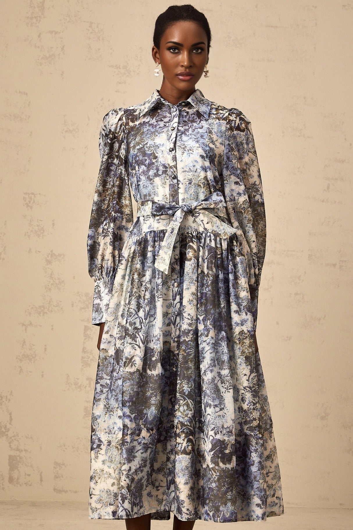 A blue midi dress with a floral print pattern named Irina