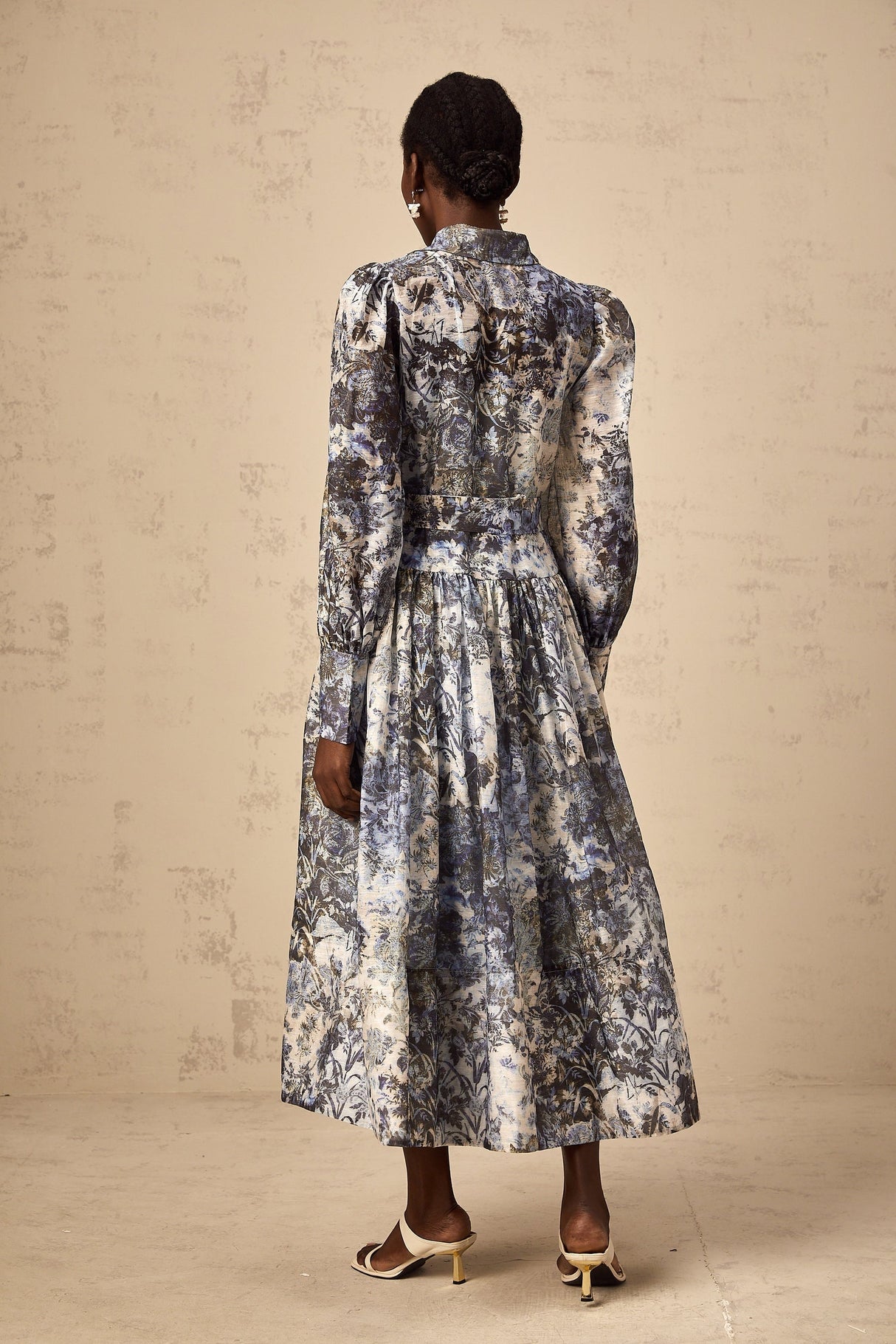 A blue midi dress with a floral print pattern named Irina