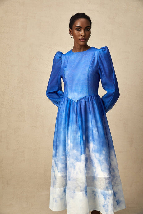 A blue midi dress with a gradient effect and pleated design named Adonia
