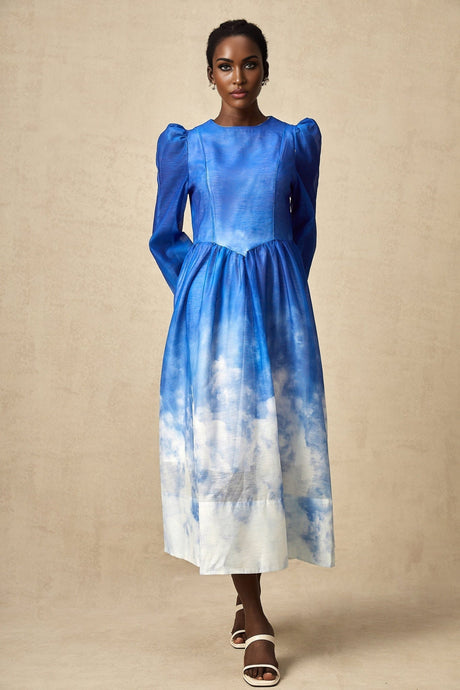A blue midi dress with a gradient effect and pleated skirt featuring a sleeveless design and fitted bodice