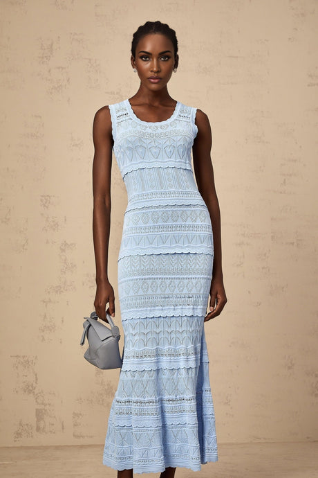 A blue midi dress with crochet knit detailing and ruffled trim accents