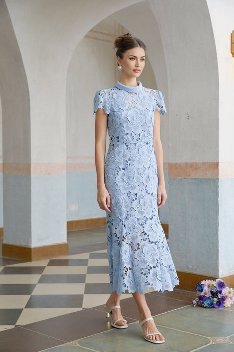 A blue midi dress with delicate floral lace applique details and an elegant feminine silhouette