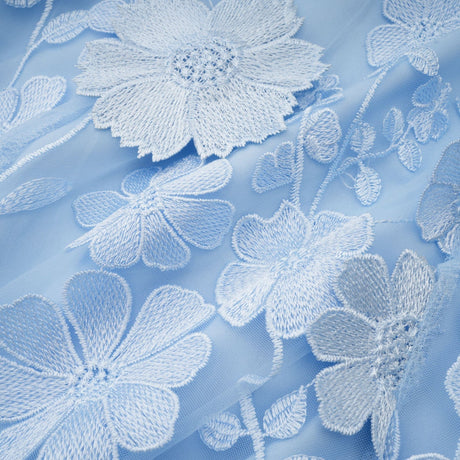 A blue midi dress with floral applique details by Herta