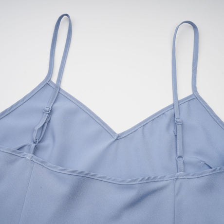 A blue midi dress with floral lace applique details and a delicate feminine design