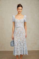 A blue midi dress with floral lace pattern and boned bodice named Audrey