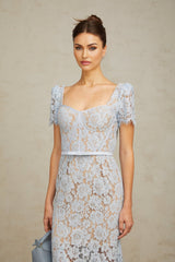 A blue midi dress with floral lace pattern and boned structure named Audrey