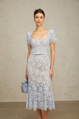 A blue midi dress with floral lace pattern and boned structure named Audrey