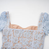 A blue midi dress with floral lace pattern featuring boned structure and named Audrey