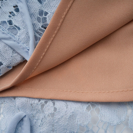 A blue midi dress with floral lace pattern featuring boned structure and named Audrey