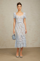 A blue midi dress with floral lace pattern featuring boned structure and named Audrey