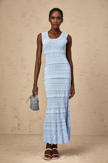 A blue midi dress with ruffled trim and crochet knit pattern featuring a feminine silhouette and delicate details