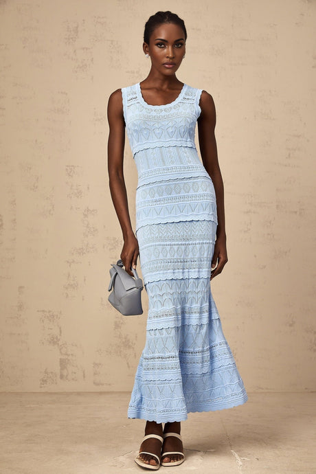 A blue midi dress with ruffled trim and crochet knit pattern featuring a fitted silhouette and delicate details
