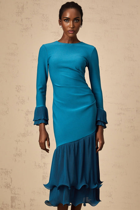 A blue midi dress with ruffled trim and paneled design featuring a feminine silhouette and flowy fabric