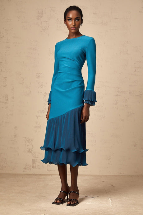 A blue midi dress with ruffled trim and paneled design featuring a Fleurida style