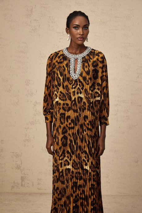 A brown leopard print midi dress with embellishments named Anais worn by a model standing against a plain background