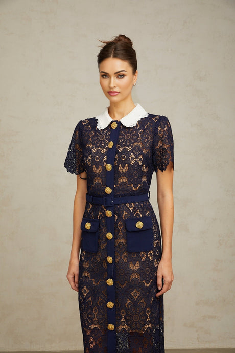 A dark blue midi dress with a floral crochet lace pattern covering the entire garment