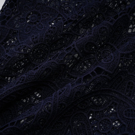 A dark blue midi dress with floral crochet lace pattern and details