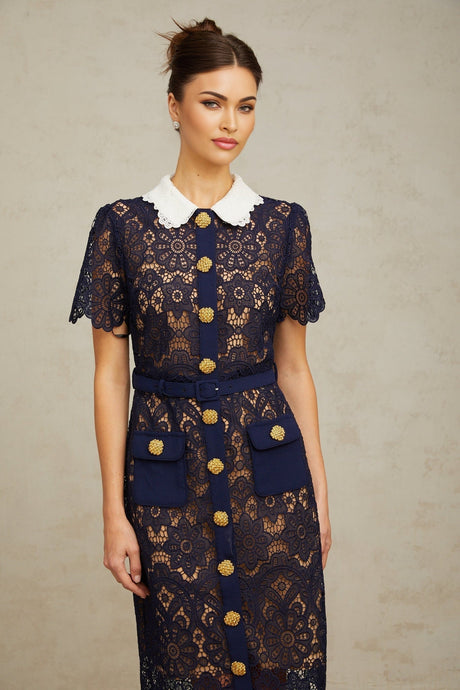 A dark blue midi dress with floral crochet lace pattern covering the entire garment featuring a feminine silhouette and intricate detailing