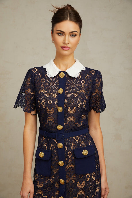 A dark blue midi dress with floral crochet lace pattern featuring an intricate design throughout the garment