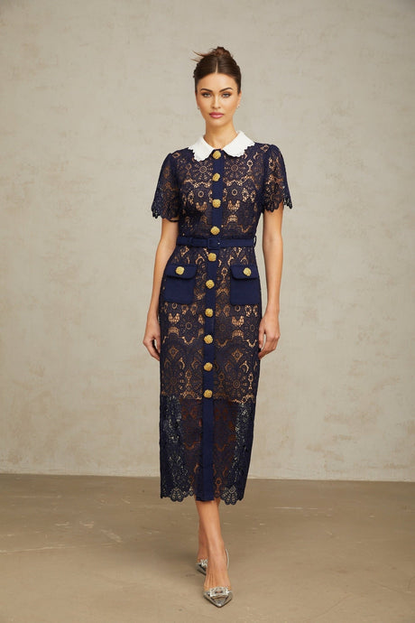 A dark blue midi dress with floral crochet lace pattern throughout the garment