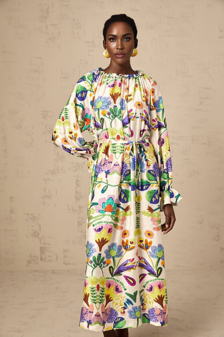 A feminine midi dress with a vibrant paisley print pattern on light poplin fabric featuring a flowing silhouette and delicate details