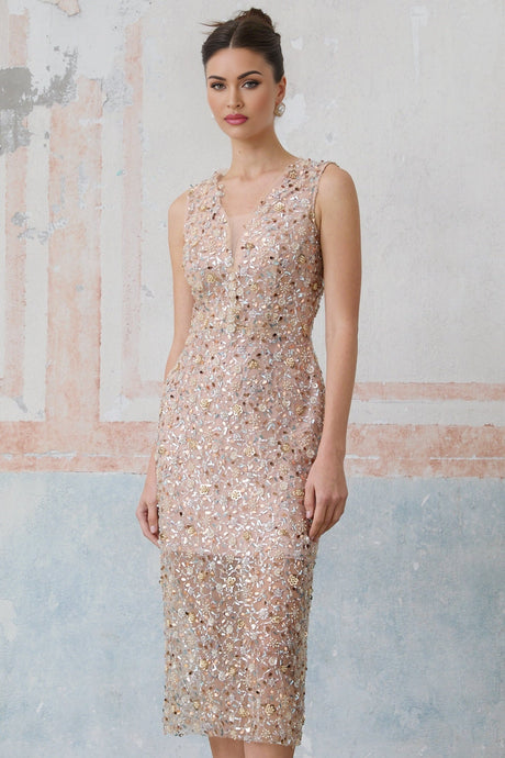 A fitted midi dress with a floral design featuring embellished Marguerite flowers adorning the fabric