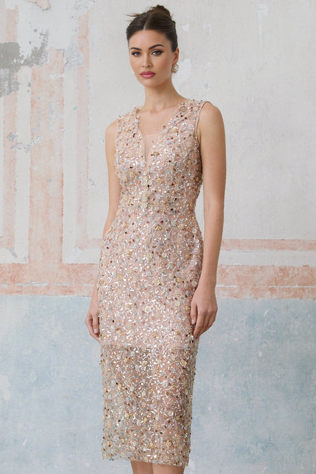 A fitted midi dress with an embellished floral pattern featuring marguerite flower motifs