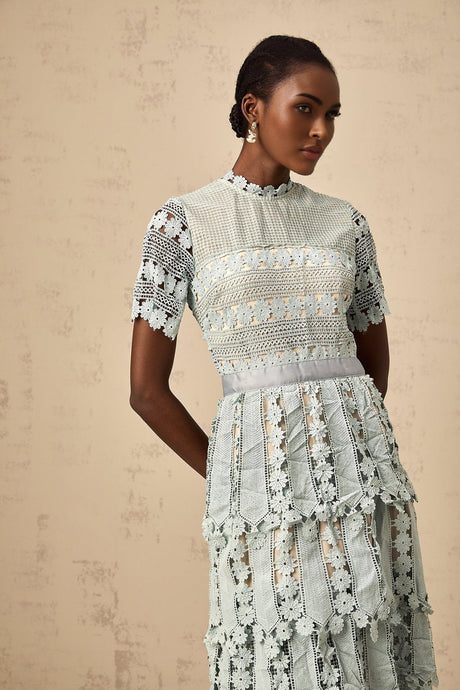 A green midi dress with floral embroidery details featuring an Oceane design