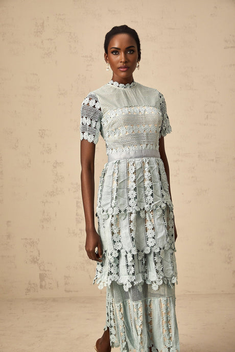 A green midi dress with floral embroidery details named Oceane